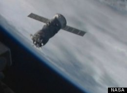 Russian caro spacecraft approaches International Space Station before successful docking.