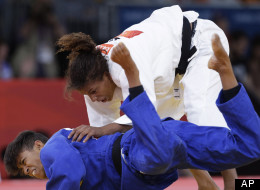 Miryam Roper of Germany competes with Rafaela Silva of Brazil, right, during the women's 57-kg judo competition at the 2012 Summer Olympics, Monday, July 30, 2012, in London. (AP Photo/Paul Sancya)
