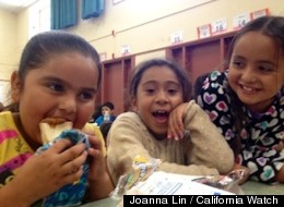 Guadalupe Chavez, who will be in second grade this fall, eats a free summer lunch with friends at Cambridge Elementary School in Concord.