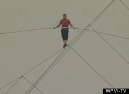 High wire artist Nik Wallenda walks more than 100 feet on a tightrope over the beach of Atlantic City.
