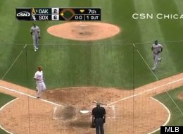White Sox catcher A.J. Pierzynski scores on a ground ball after taking advantage of a fielding error by the Oakland Athletics on Sunday, August 12, 2012.