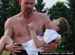 In this 2011 photo, Rick van Beek carries his daughter, Maddy, in his arms. Van Beek and Maddy have been competing in outdoor races together since 2008.