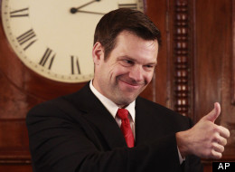 Kansas Secretary of State Kris Kobach gives a thumbs up to House members during their opening session in Topeka, Kan., on Jan. 10, 2011. (AP Photo/Orlin Wagner)