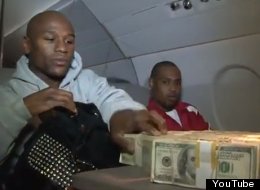 Floyd Mayweather counts his money on a private jet.