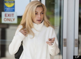 Maygan Sensenberger leaves Provincial Court in Saskatoon, Wednesday, August 29, 2012. Sensenberger, the wife of Canadian Senator Rod Zimmer is charged with causing a disturbance and one count of uttering a death threat. (CP/Liam Richards)