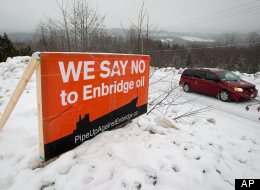 An anti-Enbridge placard stands on a property owner's lawn. (AP)
