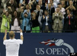 Andre Agassi acknowledges the crowd as they cheer after he defeated Marcos Baghdatis at the US Open in New York, Thursday, Aug. 31, 2006.