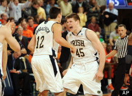 Notre Dame forward Jack Cooley racts after a basket in an NCAA college basketball game Jan. 21, 2012 in South Bend, Ind. . (AP Photo/Joe Raymond)
