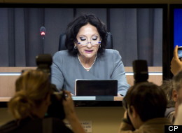 Photographers take pictures of Chairman France Charbonneau off the closed circuit television in the media room at the Charbonneau inquiry looking into corruption in the Quebec construction industry. (THE CANADIAN PRESS/Ryan Remiorz)