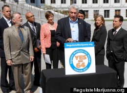 Lt. Tony Ryan (Ret.), a 36-year veteran of the Denver Police Dept. speaks at a press conference for Amendment 64. He is surrounded by former cops, prosecutors, a judge and Campaign to Regulate Marijuana Like Alcohol advocacy director, Betty Aldworth.