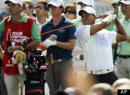 Tiger Woods hits from the tee on the 13th hole during the first round of the Tour Championship golf tournament, Thursday, Sept. 20, 2012, in Atlanta.