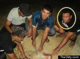 The gruesome kitten torture images were posted to the Vancouver page of a gossip site. We have blurred the portion of the photo with the animal. (TheDirty.com)