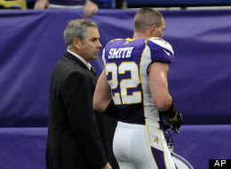 Minnesota Vikings safety Harrison Smith is escorted off the field during the first half of an NFL football game against the Tennessee Titans, Sunday, Oct. 7, 2012, in Minneapolis. Smith was ejected from the game after pushing an official who was trying to break up an on-field altercation.