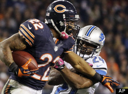 Chicago Bears running back Matt Forte (22) is pursued by Detroit Lions safety Erik Coleman (24) in the second half of an NFL football game in Chicago, Monday, Oct. 22, 2012.