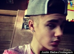 Justin Bieber shares a photo of his new owl tattoo on Instagram.