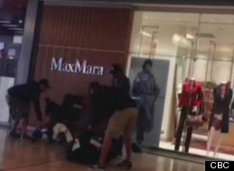 Pacific Centre mall security guards are seen taking down a man in a wheelchair after he was suspected of shoplifting. (CBC)