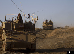 Israeli soldiers conduct a military exercise in the Israeli-controlled part of the Golan Heights, captured from neighboring Syria in the 1967 war, Wednesday, Sept. 19, 2012. The Israeli military on Wednesday conducted its largest snap drill in years as tensions with Iran over its nuclear program rise and civil war in neighboring Syria rages. (AP Photo/Ariel Schalit)