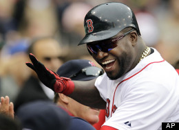 Boston Red Sox designated hitter David Ortiz celebrates as he returns to the dugout after scoring on a single by Will Middlebrooks in the fifth inning of a baseball game against the Seattle Mariners at Fenway Park in Boston, Tuesday, May 15, 2012. (
