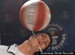 Michael Kopp, 18, set a world record by spinning a basketball on a toothbrush held between his jaws for more than 26 seconds.