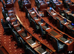 Illinois Rep. Rich Brauer, R-Petersburg, on the House of Representatives floor before the beginning of session at the Illinois State Capitol in Springfield, Ill., Monday, Jan. 3, 2011. (AP Photo/Seth Perlman)