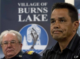 Burns Lake Fire Department Chief Jim McBride, left, looks on as Albert Gerow, Chief of Burns Lake Band, right, pauses for a moment during a news conference as he responds to the explosion at Babine Forest Products mill in Burns Lake, B.C. Saturday, Jan. 21, 2012. (THE CANADIAN PRESS/Jonathan Hayward)
