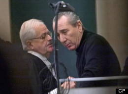 Vito Rizzuto, right, reputed head of the Montreal Mafia, speaks with his attorney Jean Salois after his hearing in Montreal on Feb. 6, 2004. A low-key mob war being waged in Quebec won’t rattle this province because Ontario is the economic engine fuelling the battle, sources say. (THE CANADIAN PRESS/Ryan Remiorz)