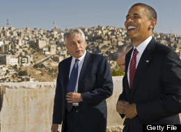 Then-U.S. Democratic presidental candidate Barack Obama (R) shares a laugh with then-U.S.-Senator Chuck Hagel R-Neb., as they tour the Citadel on July 22 2008, with the hillsides of Amman in the background. (PAUL J. RICHARDS/AFP/Getty Images)