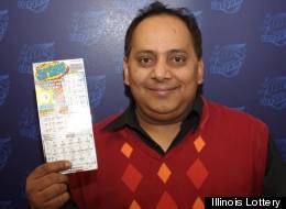 Urooj Kahn poses with his winning lottery ticket. A day after claiming his prize, Kahn died in what was later called a homicide by the Cook County Medical Examiner's office. (Illinois Lottery)