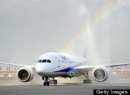 This file picture taken on July 3, 2011 shows a Boeing's 787 Dreamliner, painted in the ANA colours of white and blue, arriving at Tokyo's Haneda airport as fire engines spray it with water during a test flight. Japan's All Nippon Airways (ANA) and aviation giant Boeing said August 26, 2011 the airline will receive the world's first 787 Dreamliner on September 25, more than three years later than first planned. (YOSHIKAZU TSUNO/AFP/Getty Images)