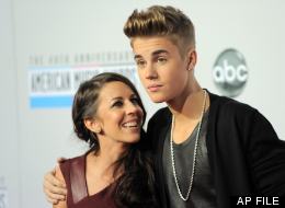 In this Nov. 18, 2012 file photo, Justin Bieber, right, and Pattie Mallette arrive at the 40th Anniversary American Music Awards, in Los Angeles. (Photo by Jordan Strauss/Invision/AP, File)