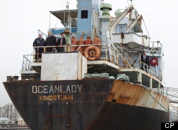 Prime Minister Stephen Harper and Citizenship and Immigration Minister Jason Kenney stand on the MV Ocean Lady in Delta, B.C. on Feb 21, 2011. The MV Ocean Lady, which was carrying illegal immigrants to Canada, was seized and towed into a port in Victoria, B.C. by the Navy on Oct. 17, 2009. (THE CANADIAN PRESS/Jonathan Hayward)