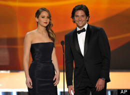 Jennifer Lawrence, left, and Bradley Cooper appear on stage at the 19th Annual Screen Actors Guild Awards at the Shrine Auditorium in Los Angeles on Sunday Jan. 27, 2013. (Photo by John Shearer/Invision/AP)