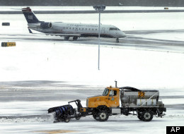 Major snowstorms in Ontario and parts of the United States have led to hundreds of cancelled flights and numerous delays. (AP)