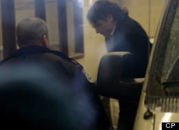 Senator Patrick Brazeau gets out of truck on his way to court in Gatineau, Que., Friday, Feb. 8, 2013 . Court documents say Sen. Patrick Brazeau has been charged with assault and sexual assault in connection with a domestic violence incident at his home. (Adrian Wyld/CP)