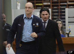 Senator Patrick Brazeau leaves a courthouse in Gatineau, Que., after he was formally charged with assault and sexual assault Friday, Feb. 8, 2013. (Adrian Wyld/CP)